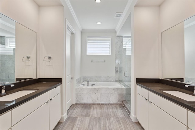 1505 Missouri St, Houston, TX 77006 - full bath with a shower stall, ornamental molding, a bath, two vanities, and recessed lighting