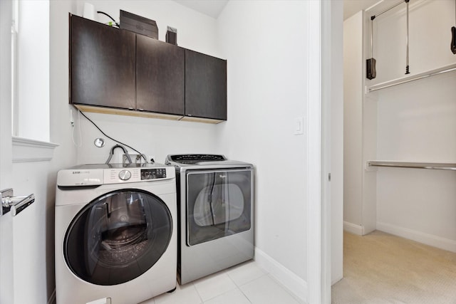 1505 Missouri St, Houston, TX 77006 - washroom featuring cabinet space, washer and clothes dryer, and baseboards