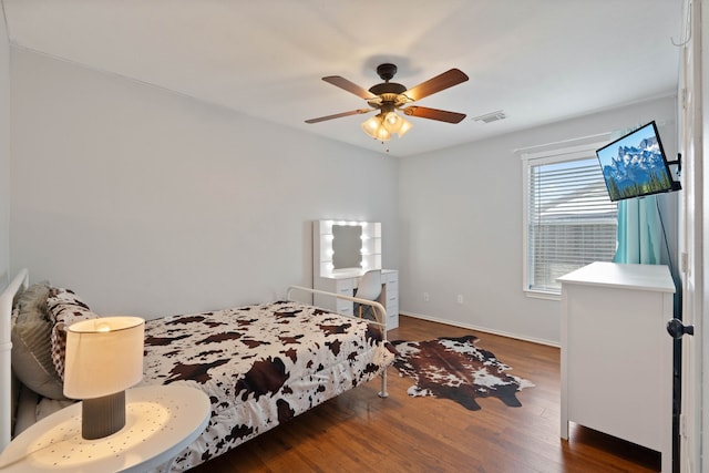 19030 Piney Way Dr, Tomball, TX 77375 - bedroom featuring wood finished floors, a ceiling fan, and baseboards