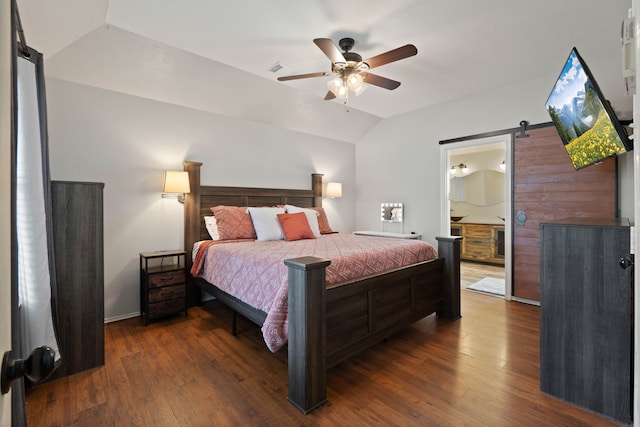 19030 Piney Way Dr, Tomball, TX 77375 - bedroom featuring lofted ceiling, dark wood-type flooring, a ceiling fan, a barn door, and ensuite bathroom