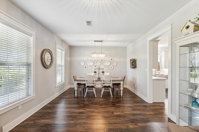 1170 Woody Ln, Sealy, TX 77474 - dining room with dark wood-type flooring and baseboards
