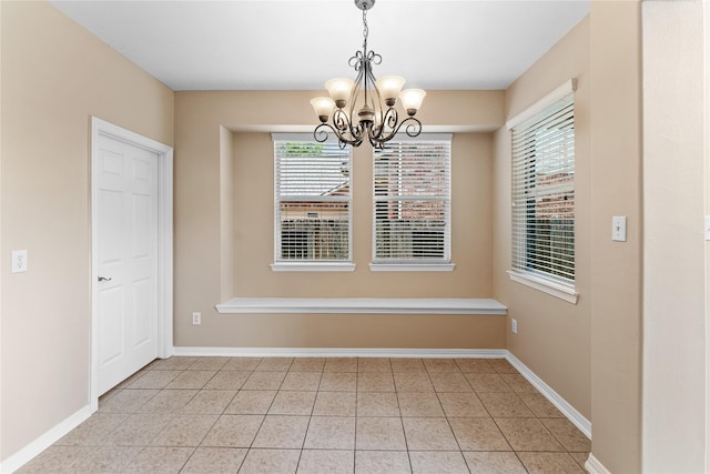 12314 Shore Lands Rd, Cypress, TX 77433 - unfurnished dining area featuring a chandelier, healthy amount of natural light, tile patterned floors, and baseboards