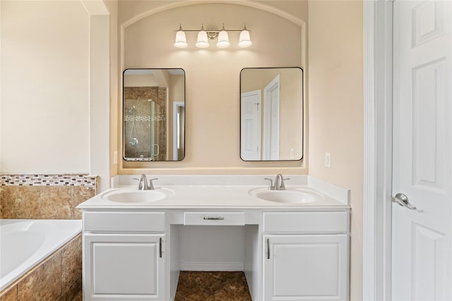 12314 Shore Lands Rd, Cypress, TX 77433 - bathroom featuring double vanity, a garden tub, and tiled shower