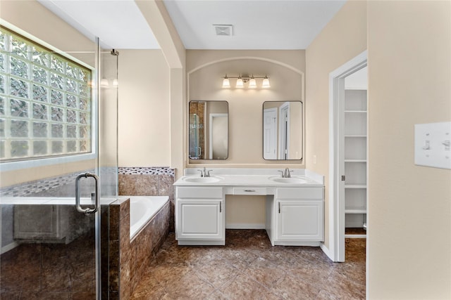 12314 Shore Lands Rd, Cypress, TX 77433 - bathroom with double vanity, a bath, a shower stall, and tile patterned floors
