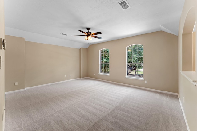12314 Shore Lands Rd, Cypress, TX 77433 - spare room with light carpet, ceiling fan, vaulted ceiling, and baseboards