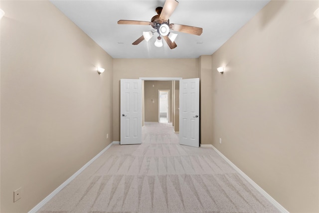 12314 Shore Lands Rd, Cypress, TX 77433 - empty room featuring light colored carpet, a ceiling fan, and baseboards