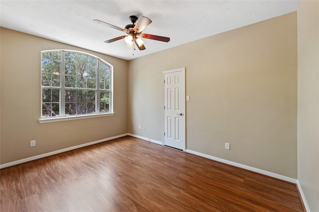 12314 Shore Lands Rd, Cypress, TX 77433 - empty room with baseboards, wood finished floors, and ceiling fan