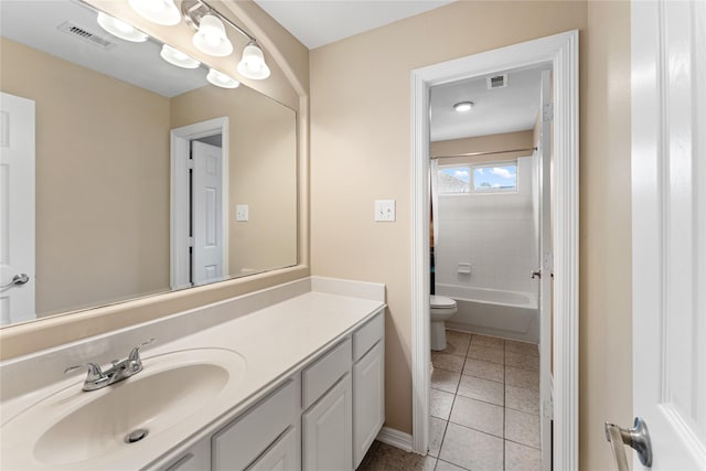 12314 Shore Lands Rd, Cypress, TX 77433 - bathroom with toilet, vanity, tile patterned flooring, baseboards, and tub / shower combination