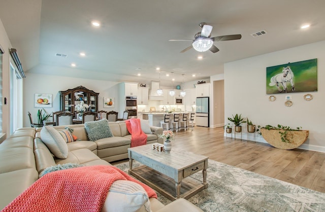 10014 Knollwood Ln, Missouri City, TX 77459 - living area featuring ceiling fan, light wood-style floors, recessed lighting, and baseboards