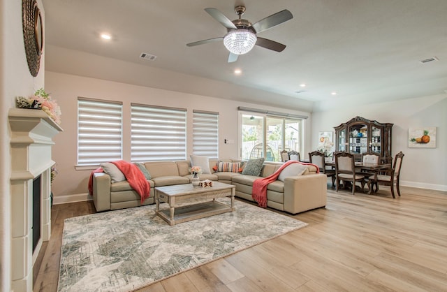 10014 Knollwood Ln, Missouri City, TX 77459 - living room with light wood-style flooring, baseboards, a ceiling fan, and recessed lighting