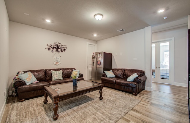 10014 Knollwood Ln, Missouri City, TX 77459 - living area featuring light wood-style flooring, baseboards, and recessed lighting