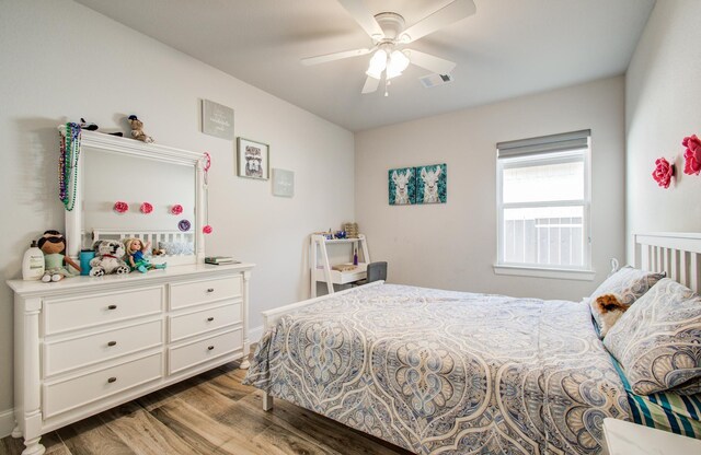 10014 Knollwood Ln, Missouri City, TX 77459 - bedroom featuring wood finished floors and a ceiling fan