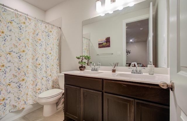 10014 Knollwood Ln, Missouri City, TX 77459 - bathroom with tile patterned flooring, toilet, double vanity, and ensuite bath