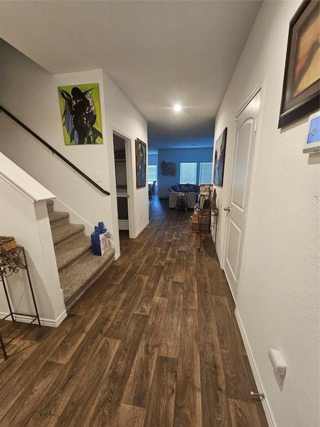 21303 Riverdew Dr, Katy, TX 77449 - hallway with dark wood-type flooring, stairs, recessed lighting, and baseboards
