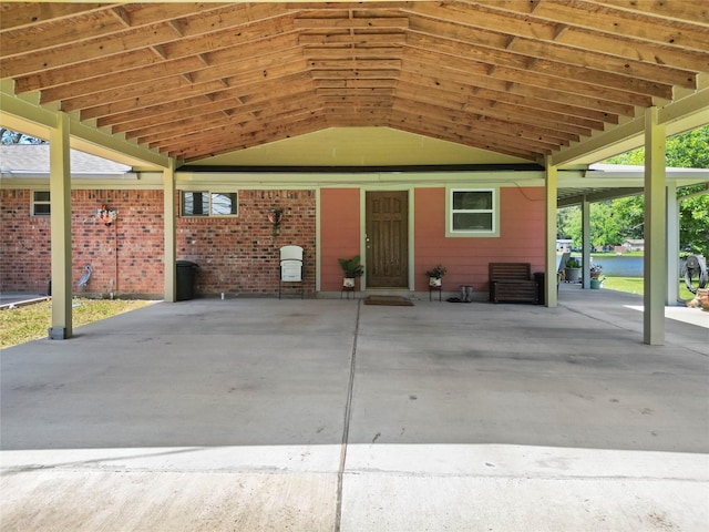 135 Sweetgum St, Trinity, TX 75862 - view of patio with a water view and a carport