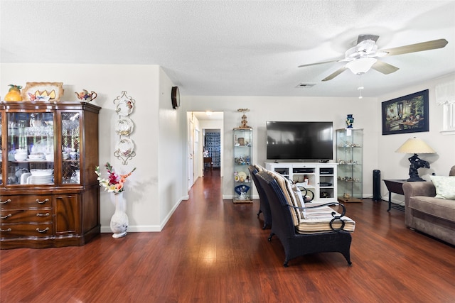 135 Sweetgum St, Trinity, TX 75862 - living room featuring ceiling fan, wood finished floors, baseboards, and a textured ceiling