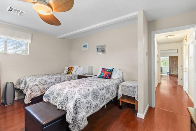 135 Sweetgum St, Trinity, TX 75862 - bedroom featuring wood finished floors, a ceiling fan, and baseboards