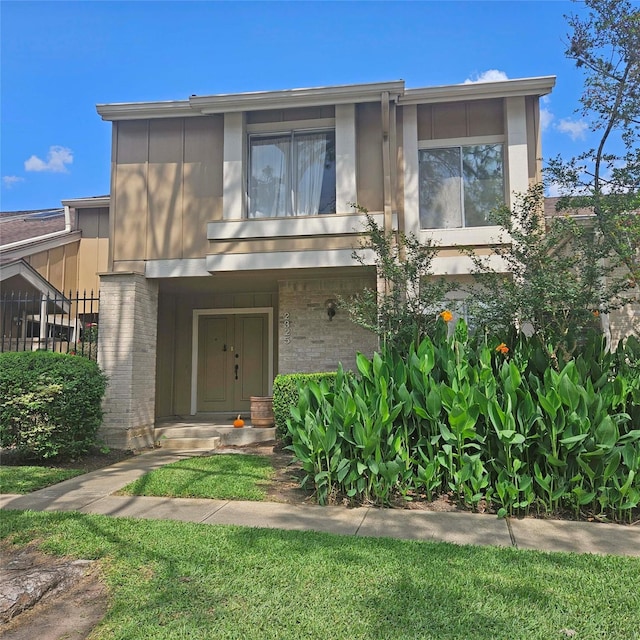 2325 Crescent Park Dr Unit 277, Houston, TX 77077 - view of front of home with brick siding, fence, and stucco siding