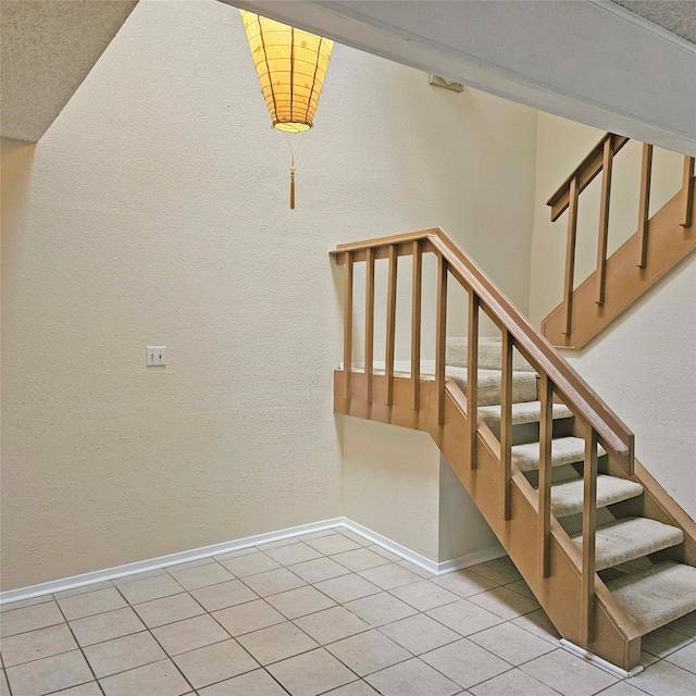 2325 Crescent Park Dr Unit 277, Houston, TX 77077 - staircase featuring baseboards, tile patterned floors, and a textured wall