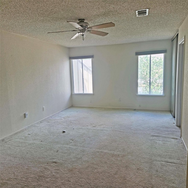 2325 Crescent Park Dr Unit 277, Houston, TX 77077 - carpeted empty room with ceiling fan, a textured ceiling, a textured wall, and baseboards