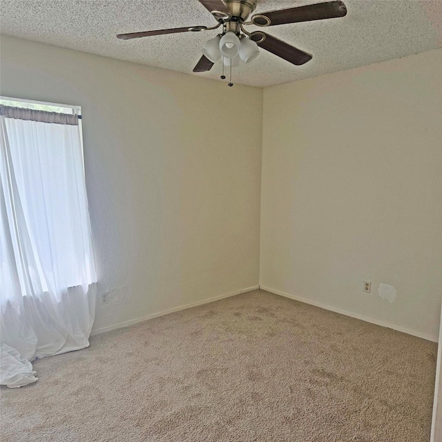 2325 Crescent Park Dr Unit 277, Houston, TX 77077 - unfurnished room with carpet floors, a ceiling fan, a textured ceiling, and baseboards