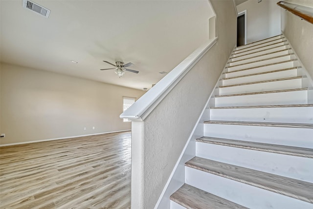 5006 Forest Hurst Gln, Spring, TX 77373 - stairs with ceiling fan, wood finished floors, and baseboards