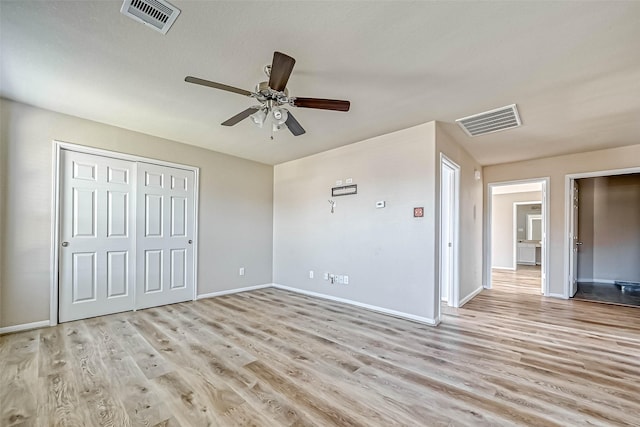 5006 Forest Hurst Gln, Spring, TX 77373 - unfurnished bedroom with light wood-style flooring, baseboards, a closet, and a ceiling fan