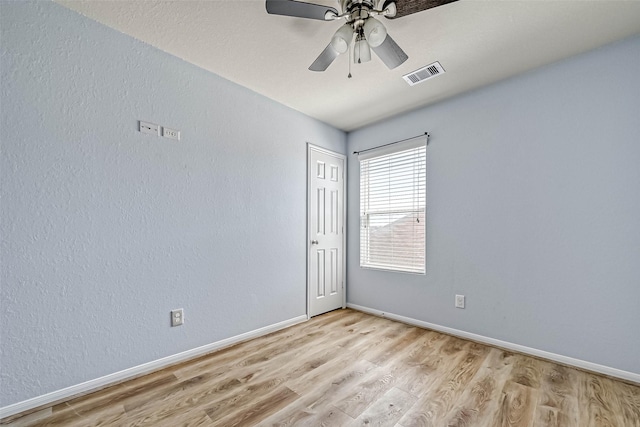 5006 Forest Hurst Gln, Spring, TX 77373 - empty room featuring light wood-style floors, baseboards, and a ceiling fan