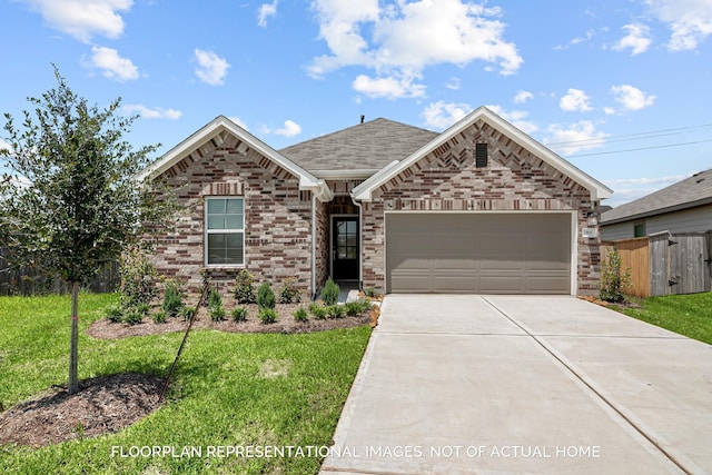 4981 Perennial Ln, La Marque, TX 77568 - view of front of home featuring a garage, driveway, brick siding, and roof with shingles