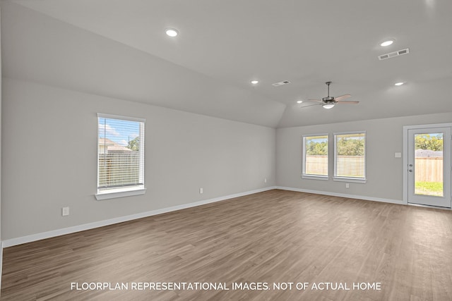 4981 Perennial Ln, La Marque, TX 77568 - unfurnished room featuring light wood-style floors, plenty of natural light, baseboards, ceiling fan, and lofted ceiling