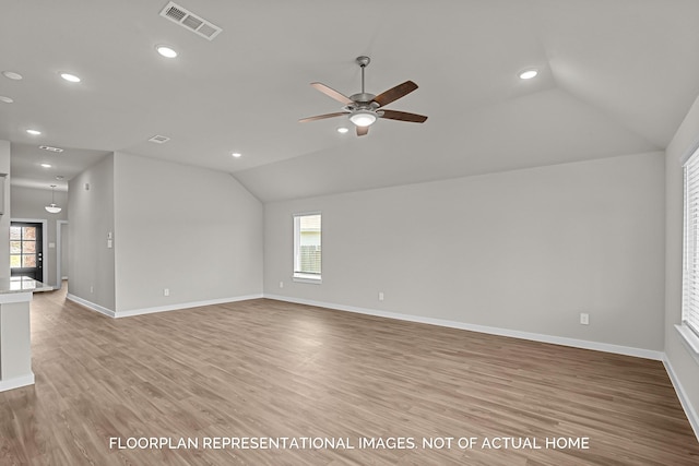 4981 Perennial Ln, La Marque, TX 77568 - unfurnished living room featuring vaulted ceiling, recessed lighting, ceiling fan, baseboards, and plenty of natural light