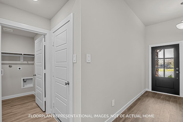 4981 Perennial Ln, La Marque, TX 77568 - laundry area featuring electric dryer hookup, wood finished floors, and baseboards