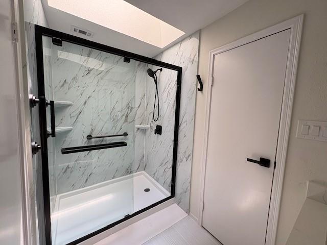 9850 Pagewood Ln Unit 909, Houston, TX 77042 - full bath featuring a marble finish shower