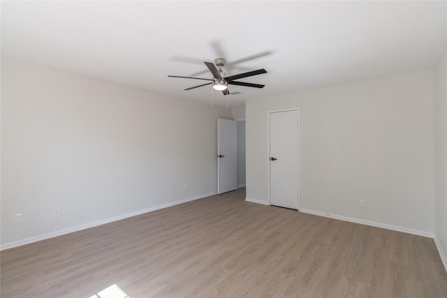 9850 Pagewood Ln Unit 909, Houston, TX 77042 - empty room featuring light wood-type flooring, ceiling fan, and baseboards