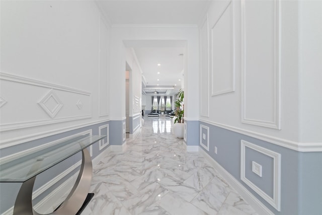 8007 Clearwater Glen Ct, Richmond, TX 77407 - hall featuring a decorative wall, light marble finish flooring, ornamental molding, wainscoting, and recessed lighting