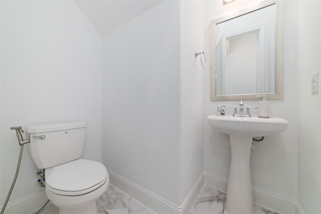 8007 Clearwater Glen Ct, Richmond, TX 77407 - half bathroom with marble finish flooring, toilet, baseboards, and a sink