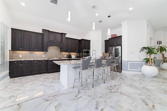8007 Clearwater Glen Ct, Richmond, TX 77407 - kitchen featuring appliances with stainless steel finishes, a kitchen breakfast bar, light marble finish floors, backsplash, and dark brown cabinetry