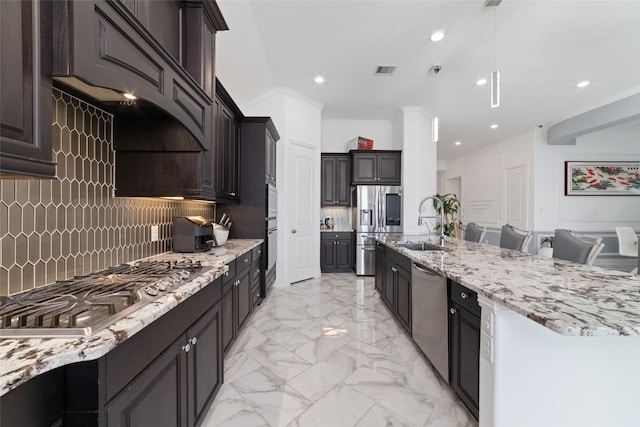 8007 Clearwater Glen Ct, Richmond, TX 77407 - kitchen with stainless steel appliances, a sink, backsplash, light stone counters, and recessed lighting