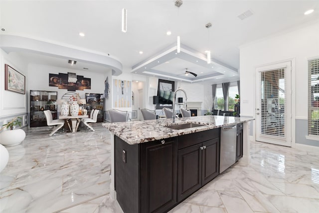 8007 Clearwater Glen Ct, Richmond, TX 77407 - kitchen with open floor plan, stainless steel dishwasher, a sink, light marble finish floors, and light stone counters