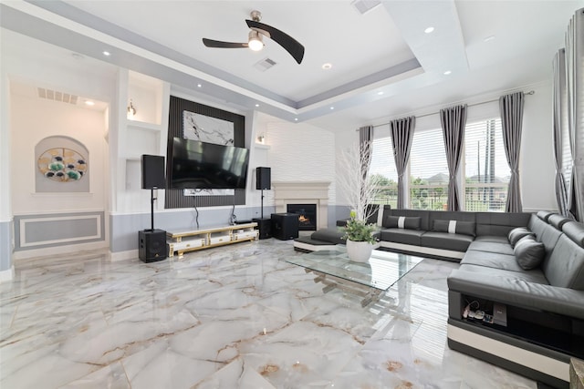 8007 Clearwater Glen Ct, Richmond, TX 77407 - living area featuring marble tiled flooring, ceiling fan, a glass covered fireplace, recessed lighting, and baseboards