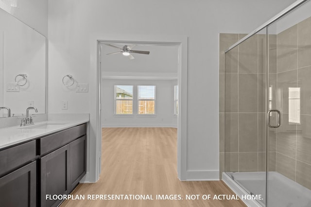 26132 Ethereal Rd, La Marque, TX 77568 - full bath with a ceiling fan, wood finished floors, a stall shower, and vanity
