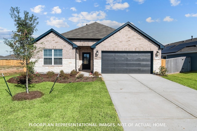 26132 Ethereal Rd, La Marque, TX 77568 - french country home with a garage, driveway, brick siding, and a shingled roof