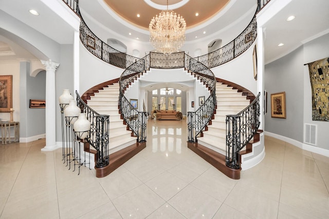 11503 Renaissance Dr, Montgomery, TX 77356 - tiled entrance foyer with arched walkways, ornate columns, recessed lighting, crown molding, and baseboards