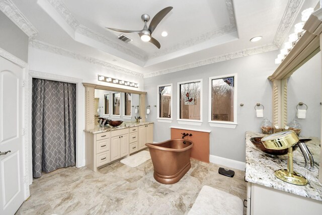 11503 Renaissance Dr, Montgomery, TX 77356 - full bathroom with a ceiling fan, a tray ceiling, vanity, crown molding, and a soaking tub