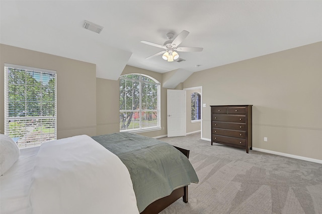 2833 Everett Dr, Friendswood, TX 77546 - bedroom featuring multiple windows, baseboards, lofted ceiling, and carpet floors