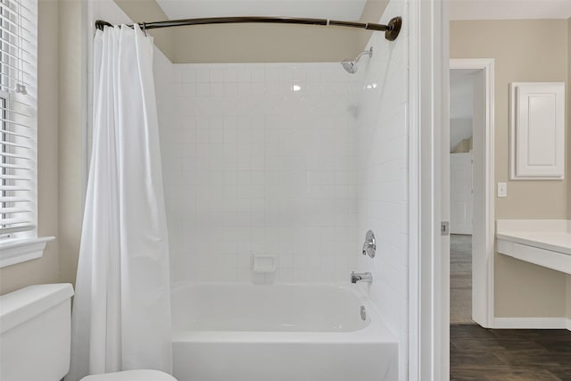 2833 Everett Dr, Friendswood, TX 77546 - bathroom with toilet, shower / tub combo with curtain, wood finished floors, and baseboards