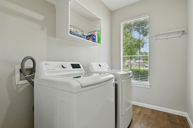 2833 Everett Dr, Friendswood, TX 77546 - clothes washing area with washer and clothes dryer, dark wood-style flooring, and baseboards