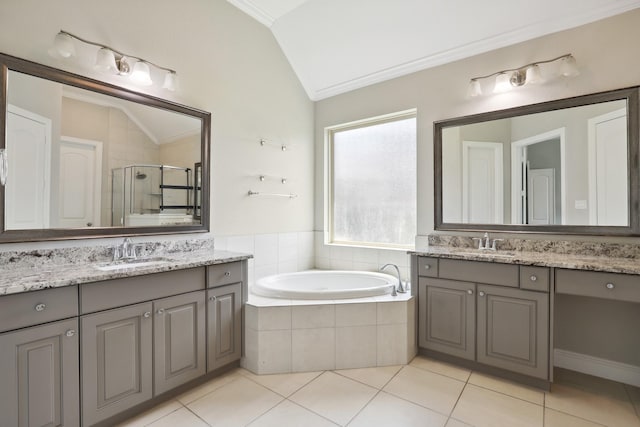 29407 Amber Meadows Ct, Katy, TX 77494 - full bathroom featuring vaulted ceiling, ornamental molding, a shower stall, a bath, and tile patterned flooring