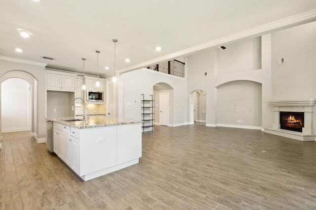 29407 Amber Meadows Ct, Katy, TX 77494 - kitchen featuring stainless steel appliances, a sink, baseboards, white cabinets, and recessed lighting