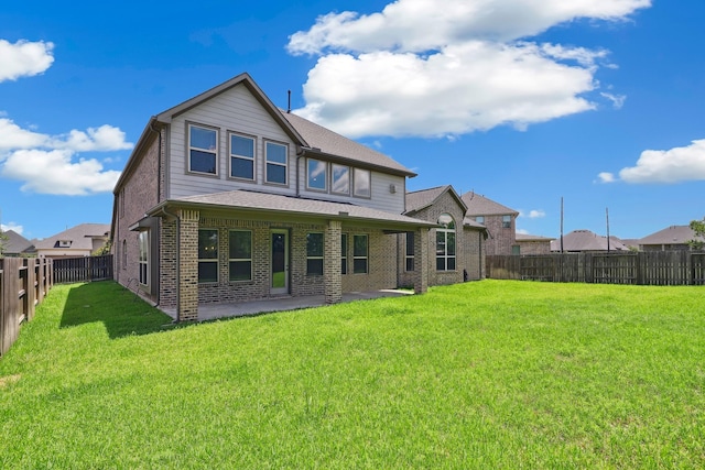29407 Amber Meadows Ct, Katy, TX 77494 - back of house featuring brick siding and a patio area